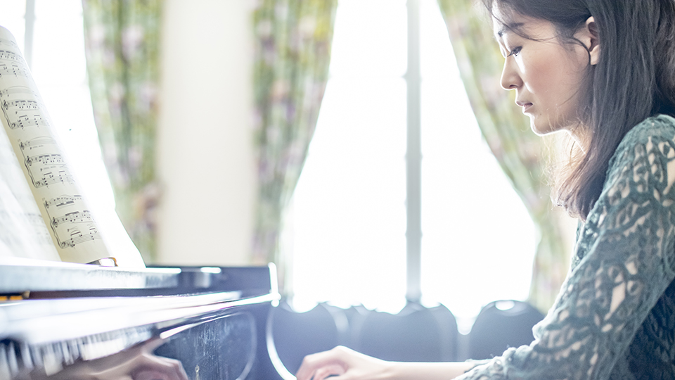 Japanese student playing the piano